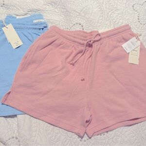 NWT cozy reflex brand pair of pink and blue shorts with drawstring and pockets